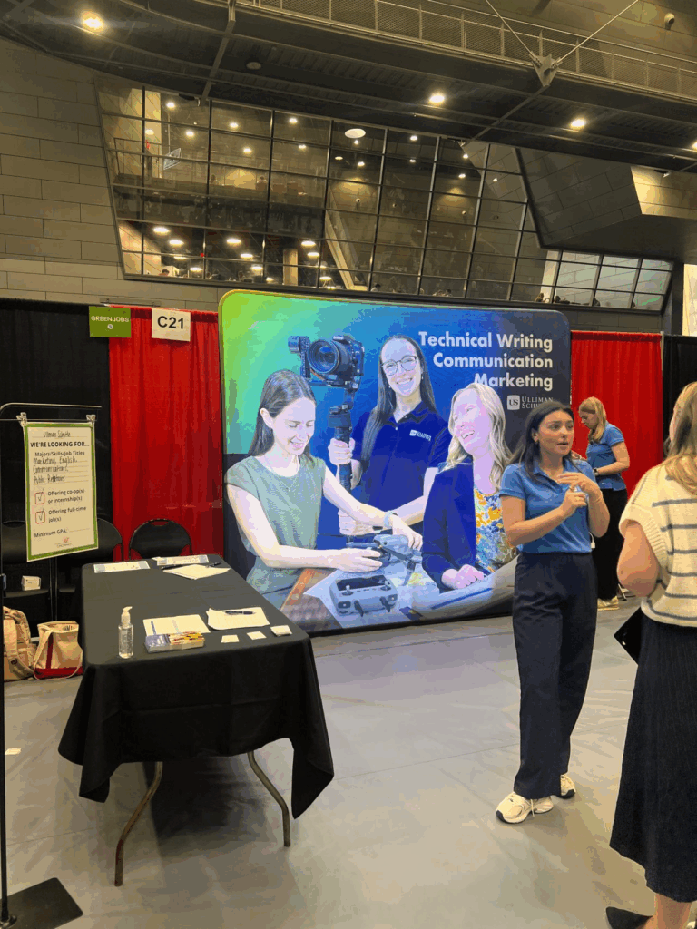 Employer with Green Jobs signage @ Fall Career Fair. Photo credit: Net Impact UC